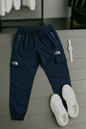 "Men’s Beige Cargo Trousers – Casual Streetwear with Zipper Pockets | The North Face Style"